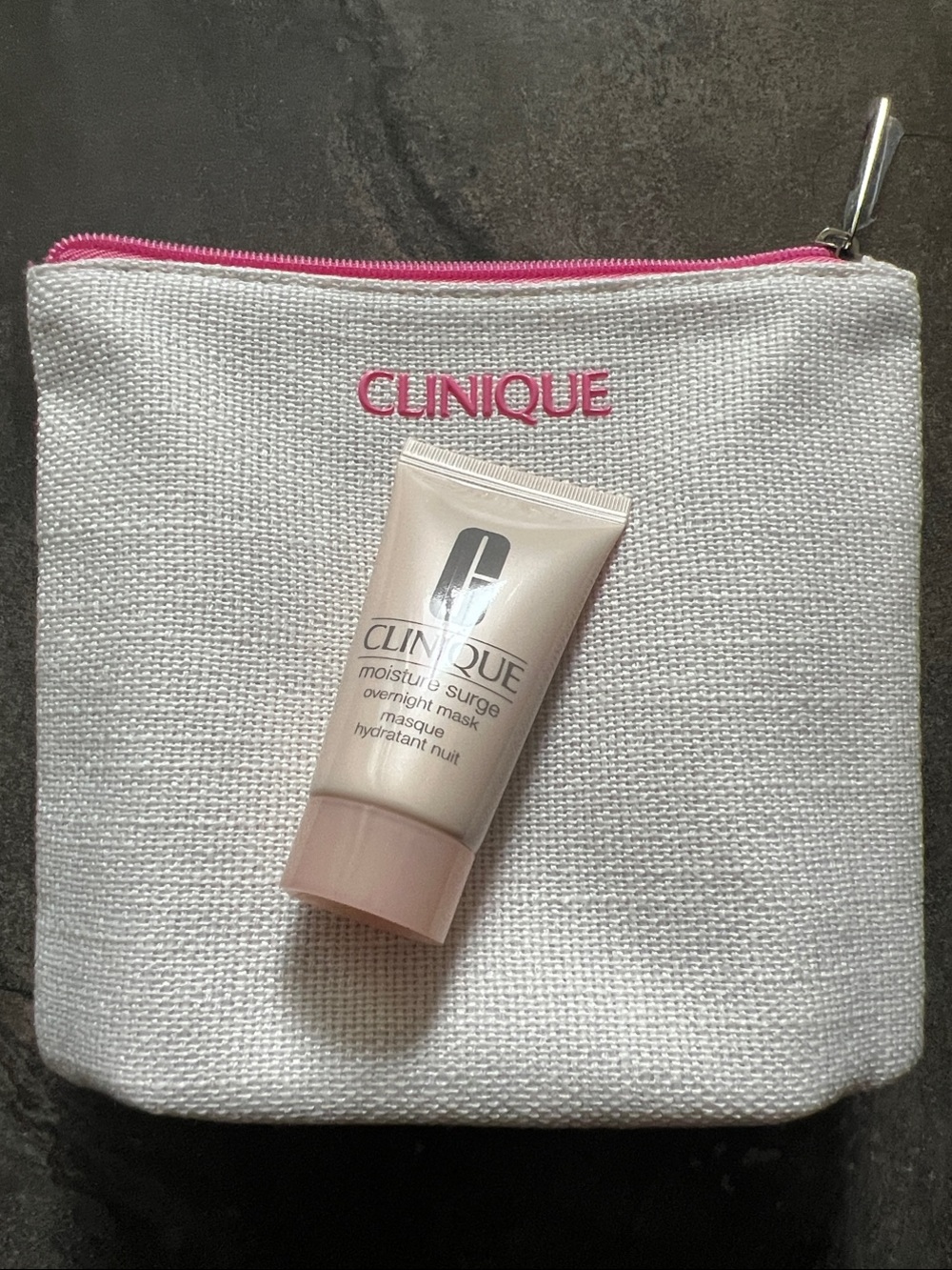 Clinique White Cosmetic Pouch with Pink Trim with Mini Moisture Surge Overnight